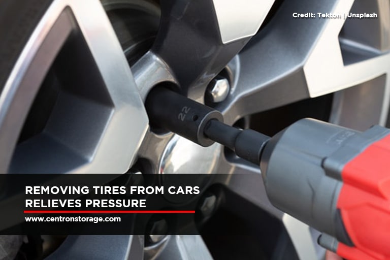 Removing tires from cars relieves pressure