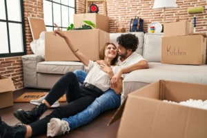 couple unpacking belongings in their new apartment