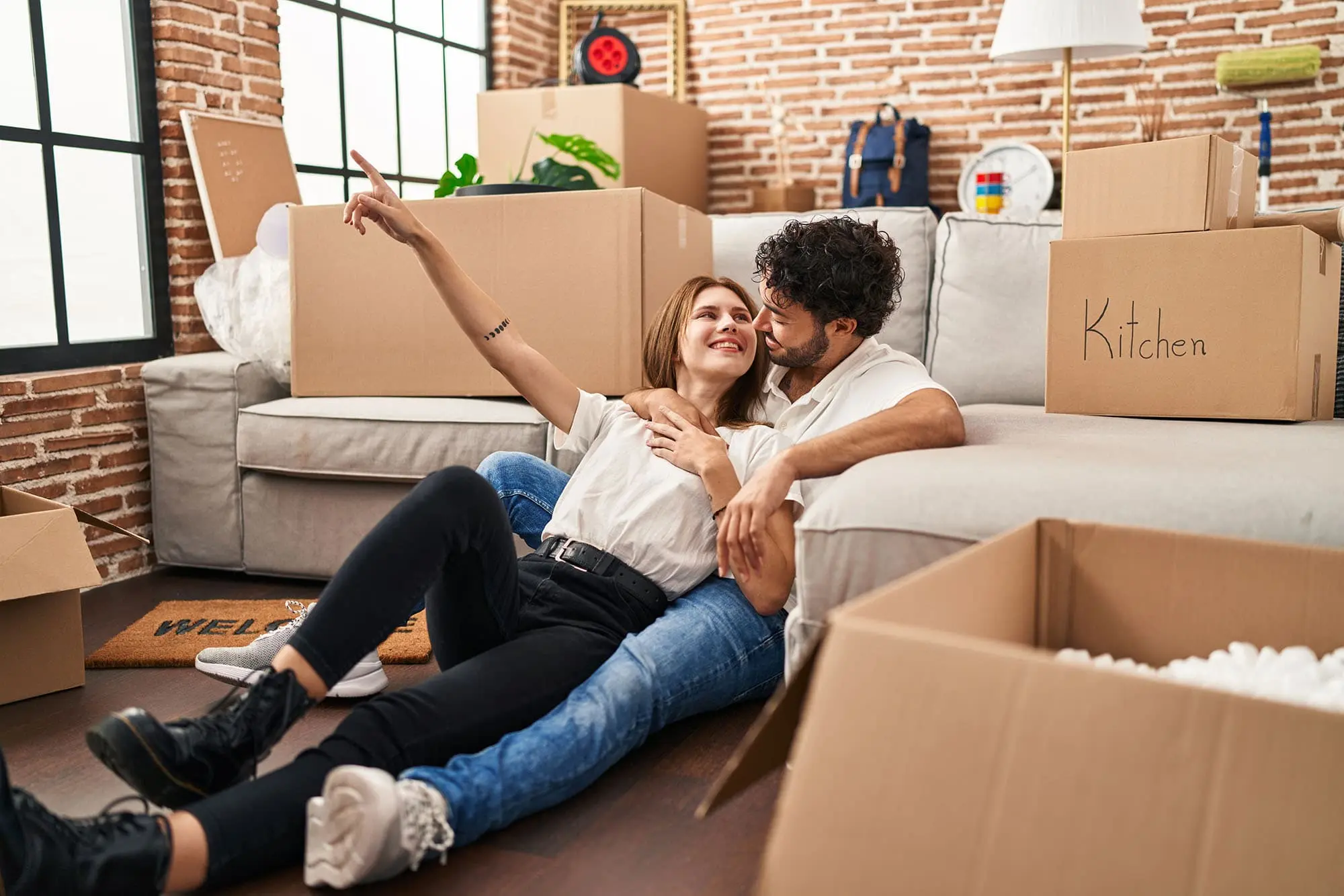 couple unpacking belongings in their new apartment